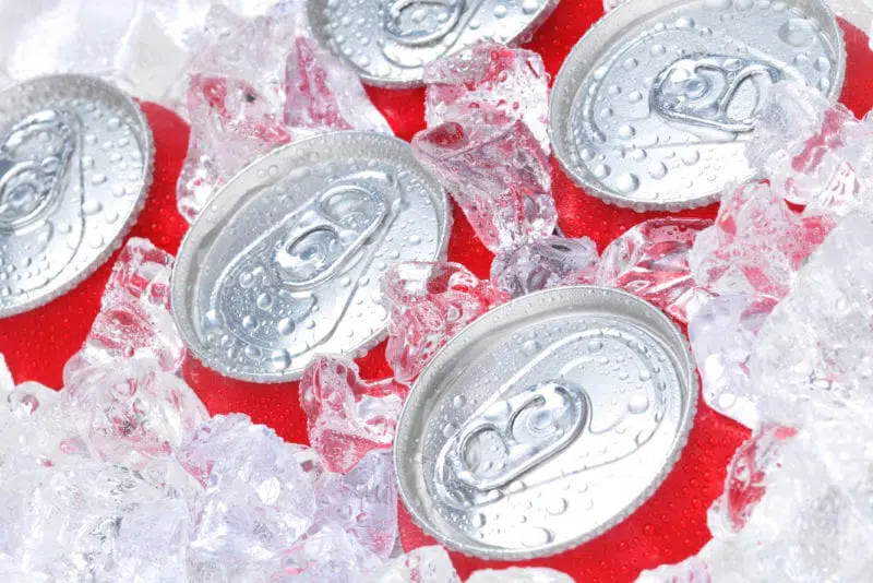 coca-cola cans in ice